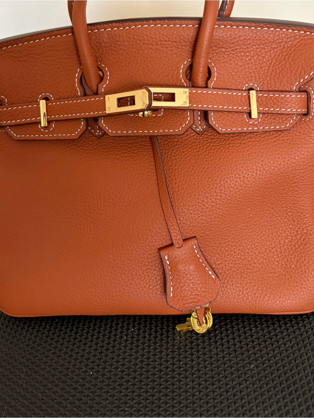 Classic style 25cm Leather Top-Handle Bag in “gold on gold”.